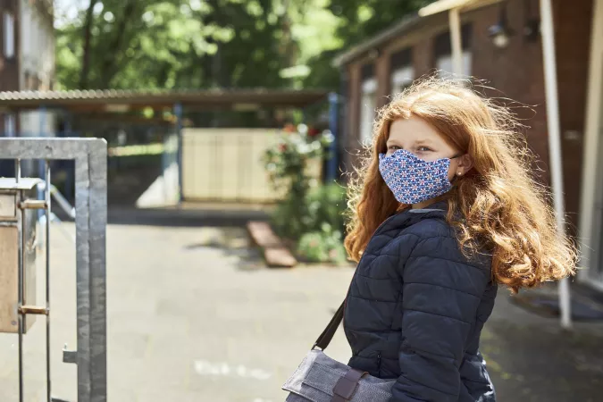 [NAME CHANGED] Hanna going to school wearing a protective mask in Cologne, Germany, on May 15th, 2020.