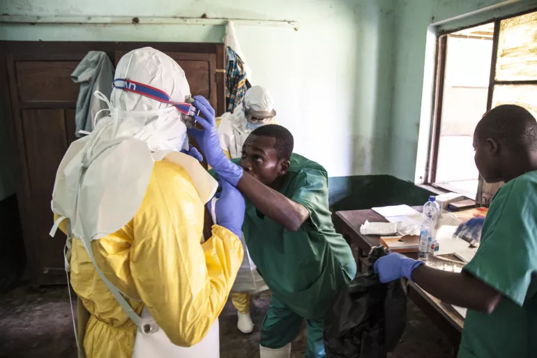 Health workers get ready to attend to suspected Ebola patients in Bikoro Hospital, the epicenter of the latest outbreak in the Democratic Republic of the Congo on 12 May 2018