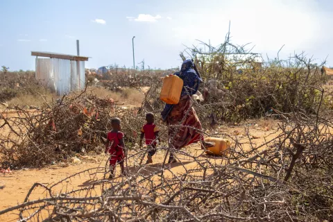 Fetching water in an internally displaced persons camp.