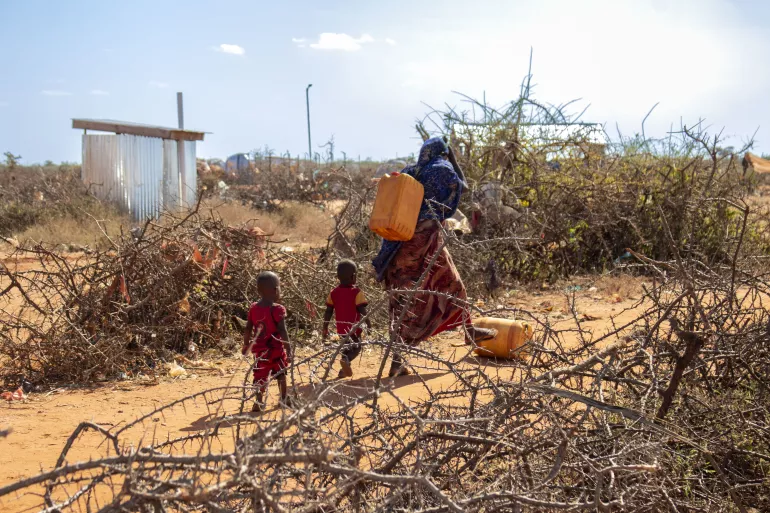 Fetching water in an internally displaced persons camp.