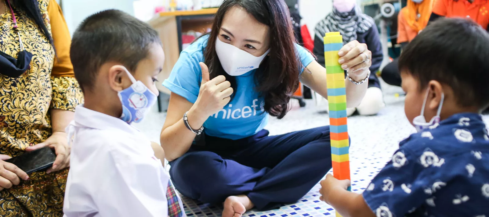 UNICEF Representative for Thailand playing with a young child
