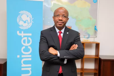 New Regional Director, Mr. Gilles Fagninou's headshot with UNICEF logo in the backdrop.