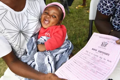 Baby happy with her birth certificate
