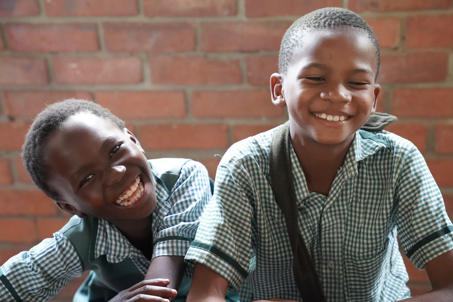 Two smiling boys at school in Zambia