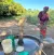 Headwoman Regina Phiri drawing water in Mpanshya village.