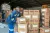 Boxes of RUTF food in warehouse with workers