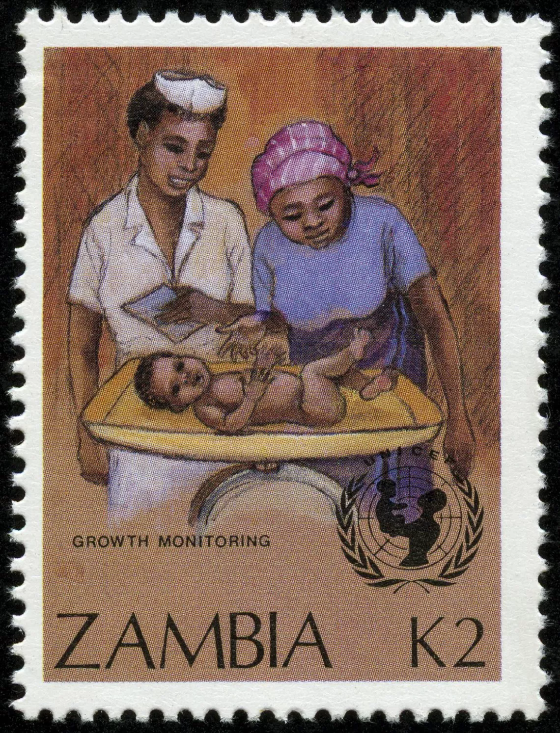 Postage stamp shows nurse and mother looking at baby