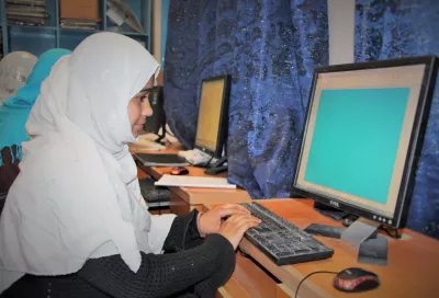 Samira, 17, sets up a Power Point presentation in the computer room at a high school for girls in Kandahar
