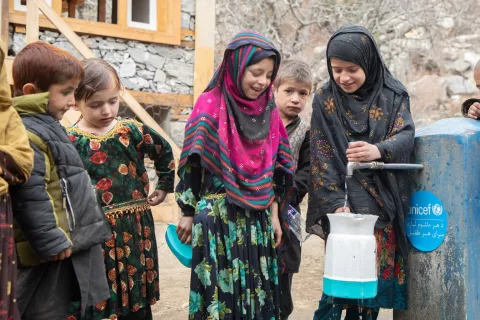 On 29 November 2023, children fetch water from a new water tap in a village in Nuristan province's Kantiwa Valley in Afghanistan, where they never had clean and safe water before.
