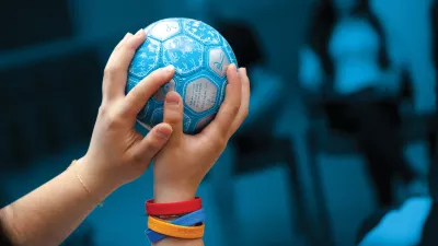 UNICEF blue small ball in child's hands.