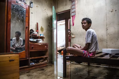 Makereta Nasiki, 13, sitting in what used to be her room, after the devastating path Cyclone Winston took trough the town of Ba on Viti Levu Island of Fiji.