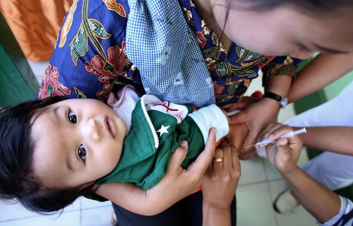 A baby being vaccinated in Indonesia