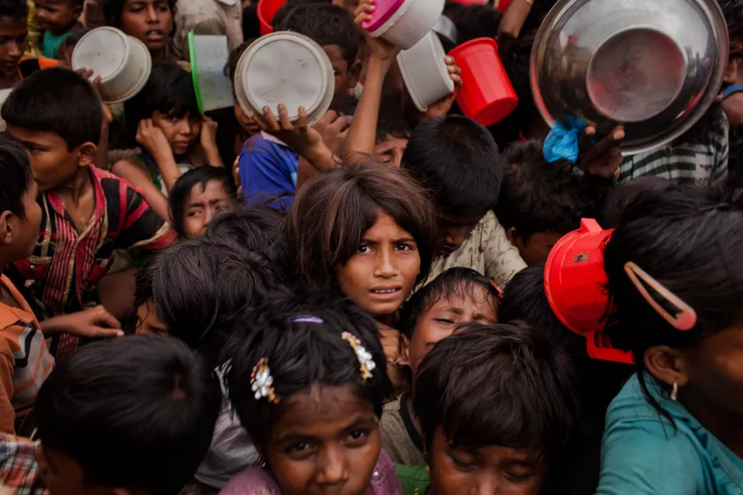 Thousands of Rohingya refugee children queue for aid at the Mainnerghona distribution center, Cox's Bazar