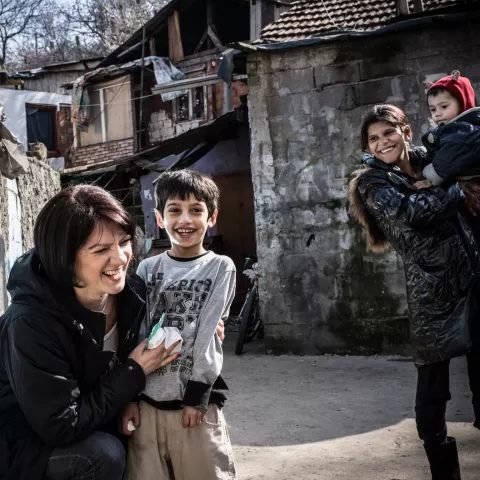 A visiting nurse, checks up on children at a 'non-hygienic settlement' on Patrijarha Dimitrija street in Belgrade, Serbia.