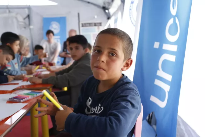 Children drawing in a psychosocial support session at a UNICEF-supported child friendly center at the Selam Camii temporary shelter in Hatay, after two devastating earthquakes hit south-east Türkiye.