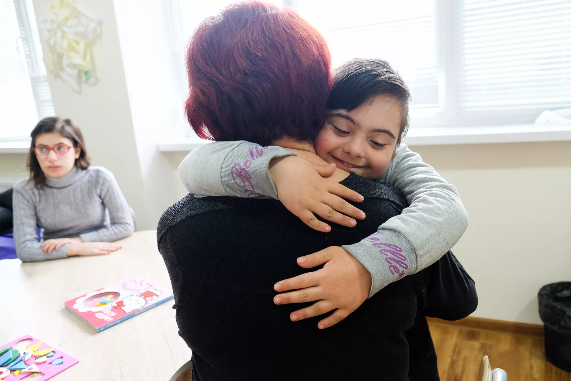Karina, 10, hugging her mother Gaiane