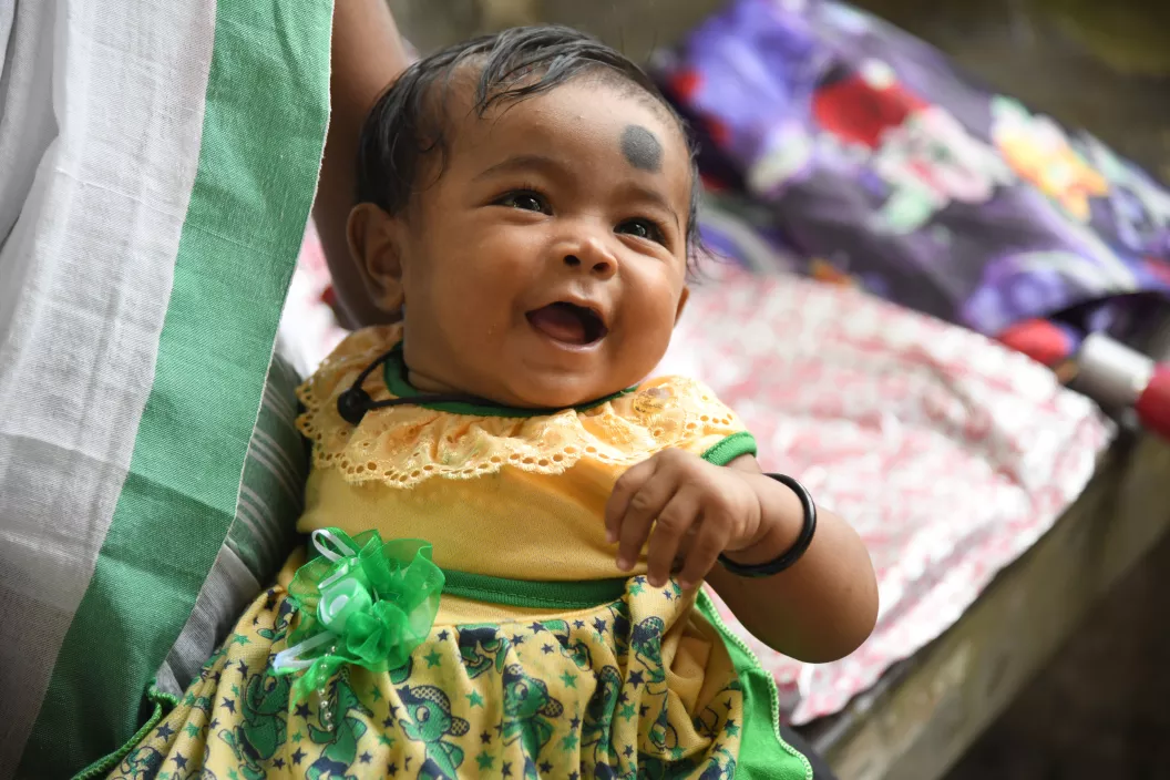 Mahi Urang, 4 month old smiles at a health center at Muttuck Tea Estate Estate in Dibrughar, Assam on June 29, 2019.
