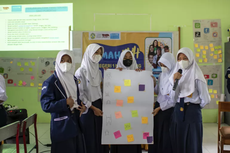 Students presenting the results of a Board Game