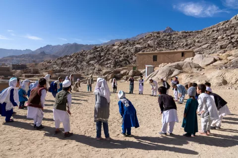 Children playing a game outdoors, Afghanistan