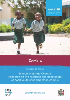 Cover of report on schools in Zambia featuring girls playing at school