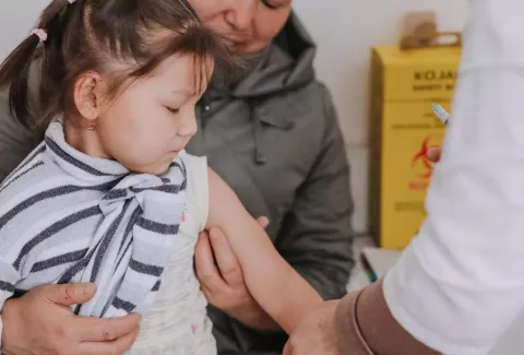 girl receiving a vaccine