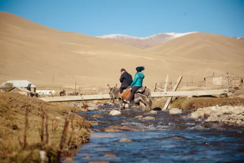 Every day elementary school students Nurzada and Nurislam travel through mountains and rivers to reach the school in Naryn region.