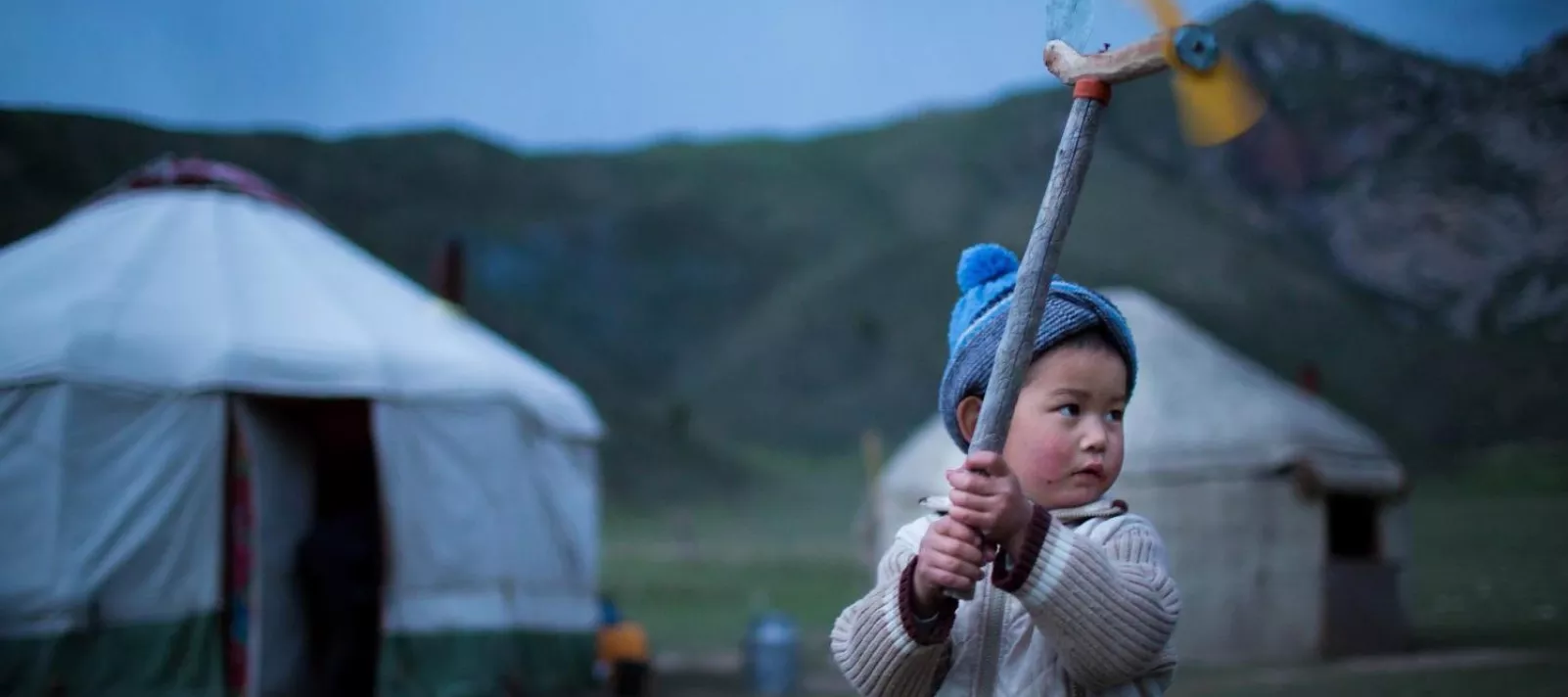 A boy plays in Naryn