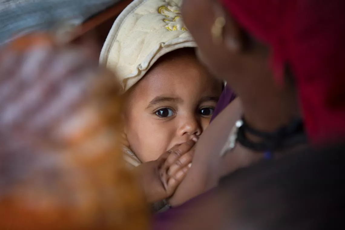 A baby is breastfed in Ethiopia