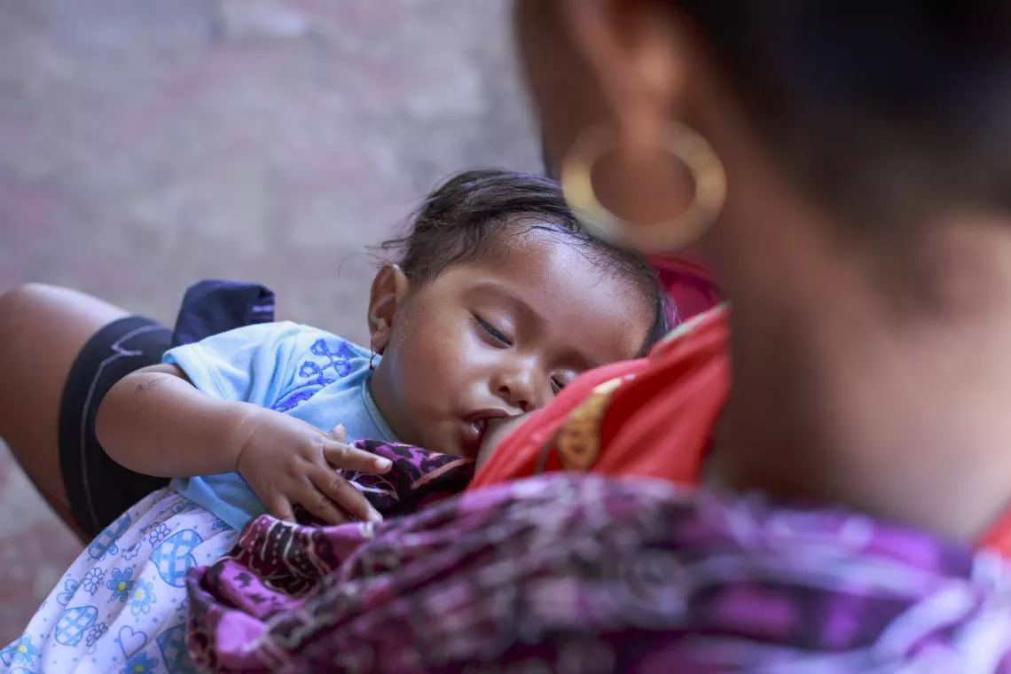 A baby breastfeeds in Timor-Leste