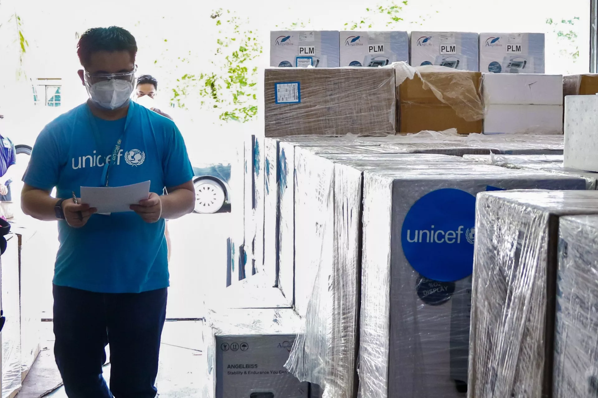 UNICEF staff in supply room