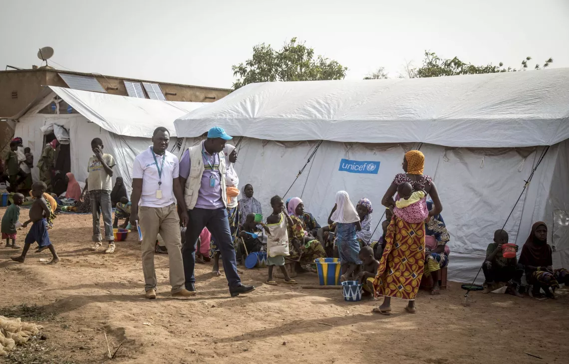UNICEF field staff at a newly created displacement site in Sevare. Following the mass displacement of families from Bankass and Bandiagara, UNICEF is supporting IDP sites in Mopti and Sevare through tents and other basic supplies, as well support to mass vaccination campaigns. 