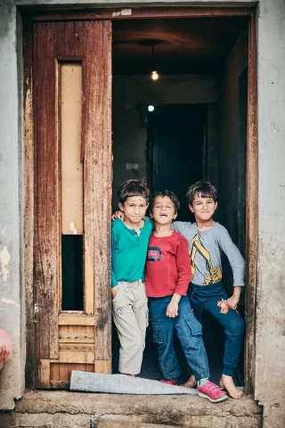 Three boys at the door