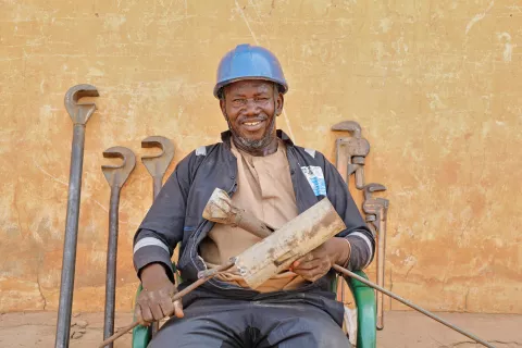 Haruna Sadiq 56, a Local Area Mechanic pose for a portrait  in Gigane Village, Bui Ward, Kebbi State