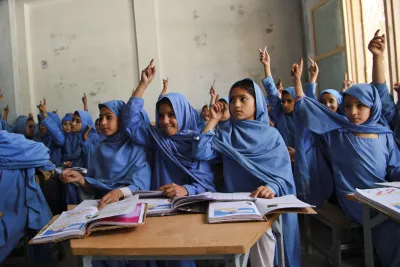 Girl students participating in class