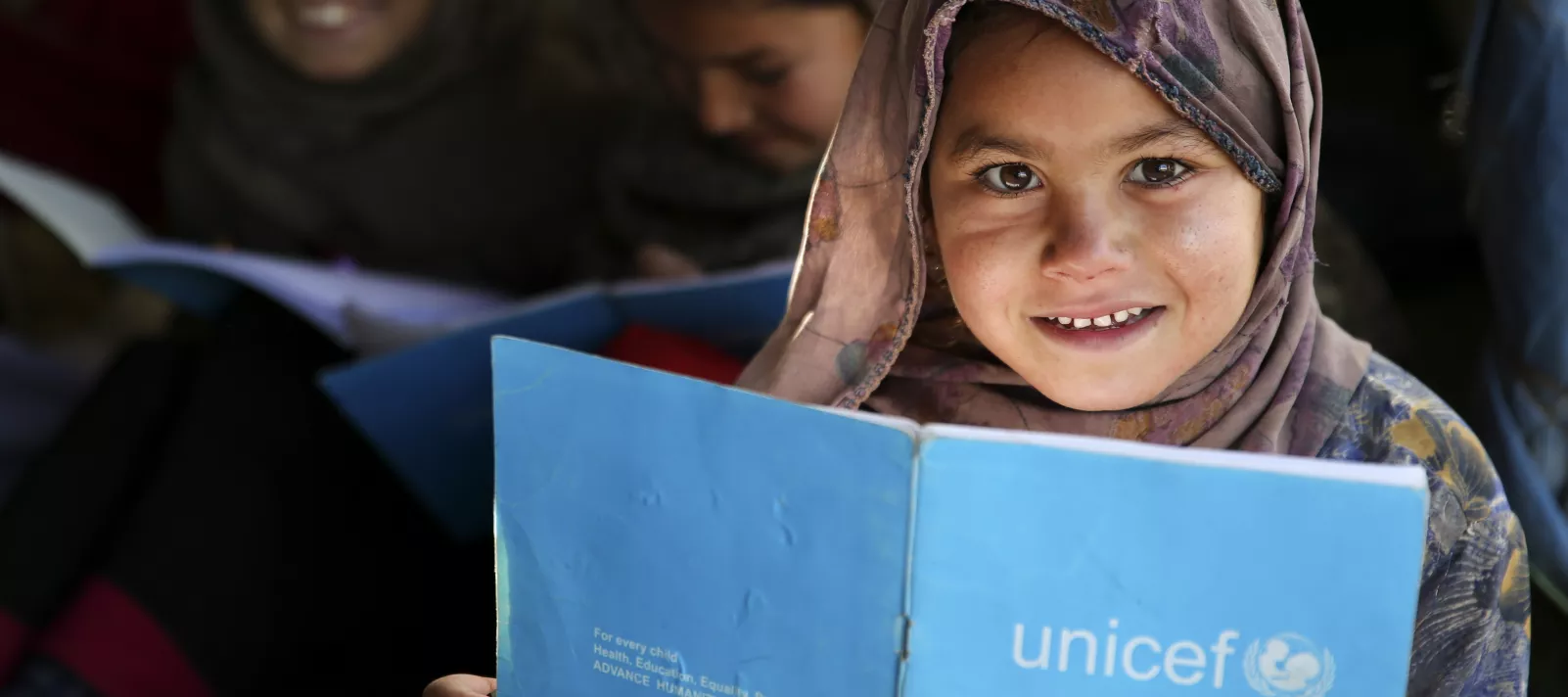 Muharra attends her class in UNICEF supported school in Jalozai camp, KPK
