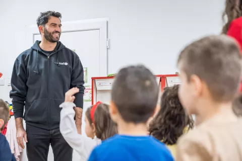 Horia Tecau playing with children in Brasov