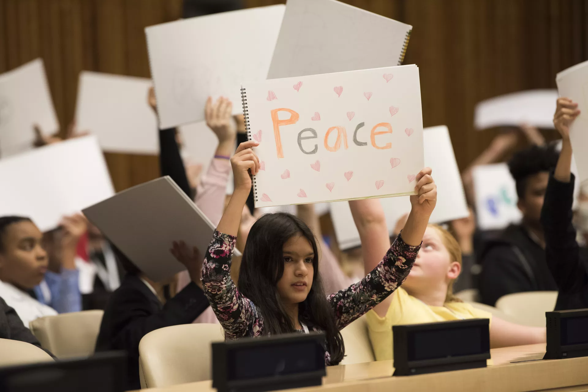 Convention on the Rights of the Child: Children hold up drawings at an event to mark World Children’s Day in the United Nations Headquarters, 2017.