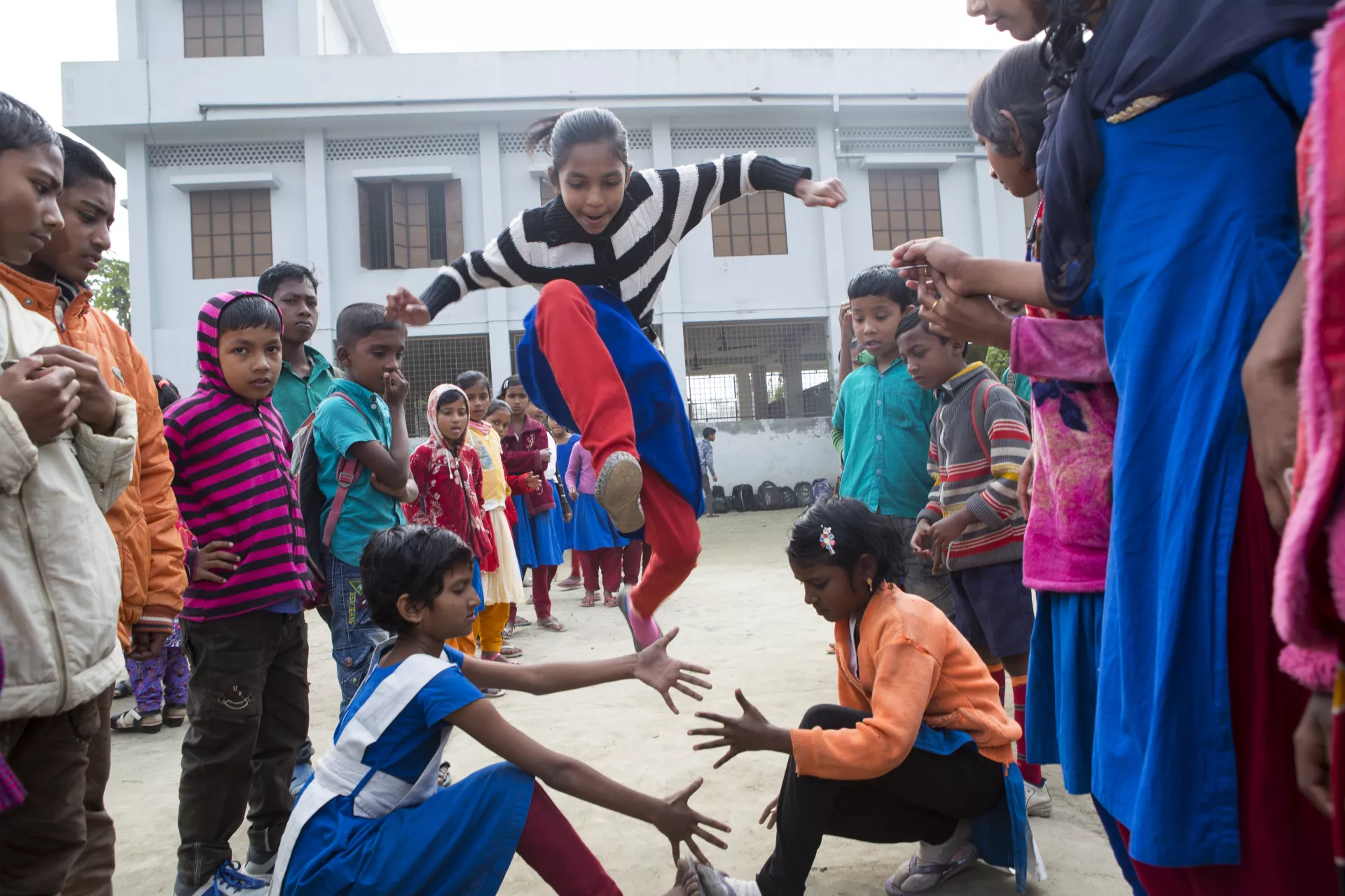 Convention on the Rights of the Child: A group of children play in a school playground in Bangladesh.