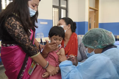 A child is vaccinated at the Durbar High School in Kathmandu, Nepal.