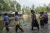 School children walking through flood waters