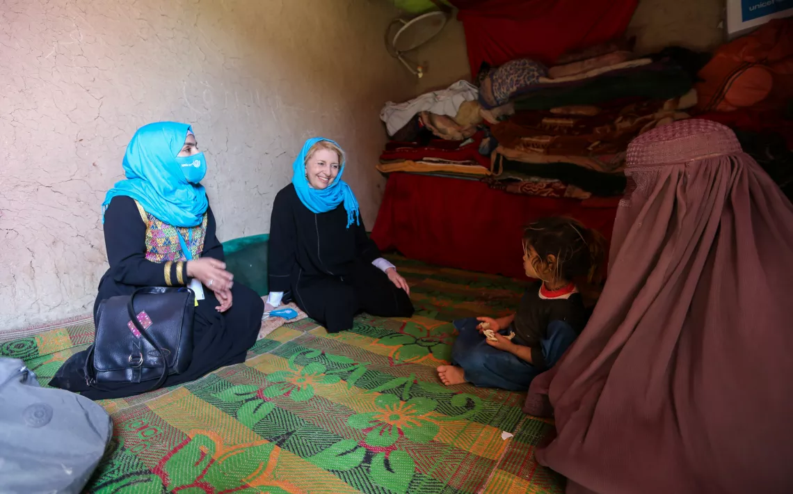 Catherine Russell at Saeeda’s family at their home in Kandahar, Afghanistan. 