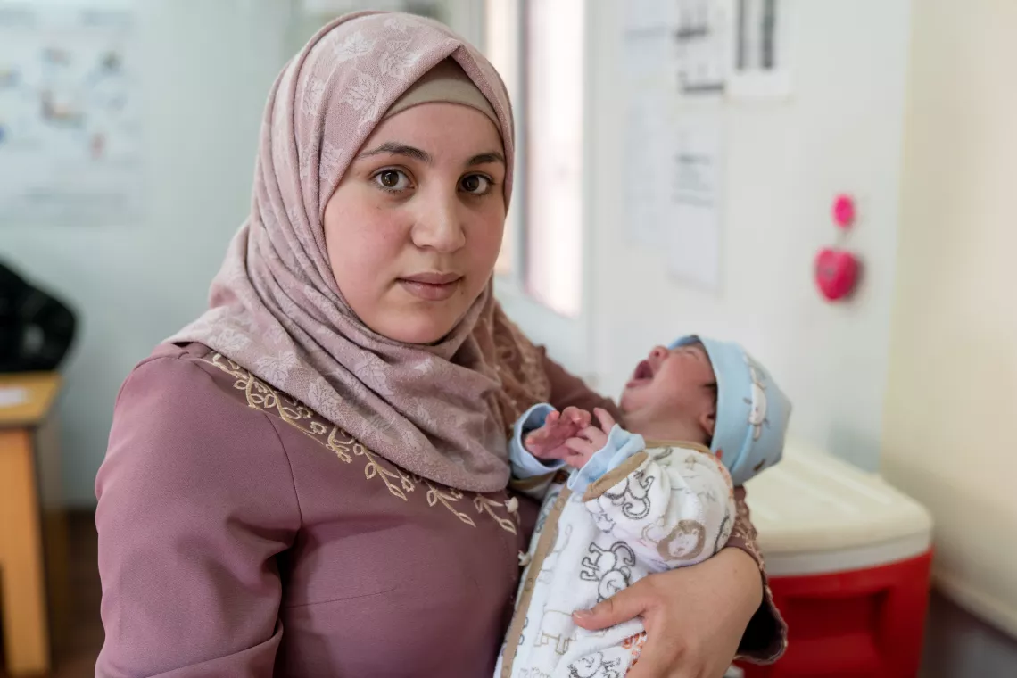 Sham, 3 months old, receives her vaccinations in one of the UNICEF-supported health clinics in Azraq Refugee Camp, Jordan, in 2019.