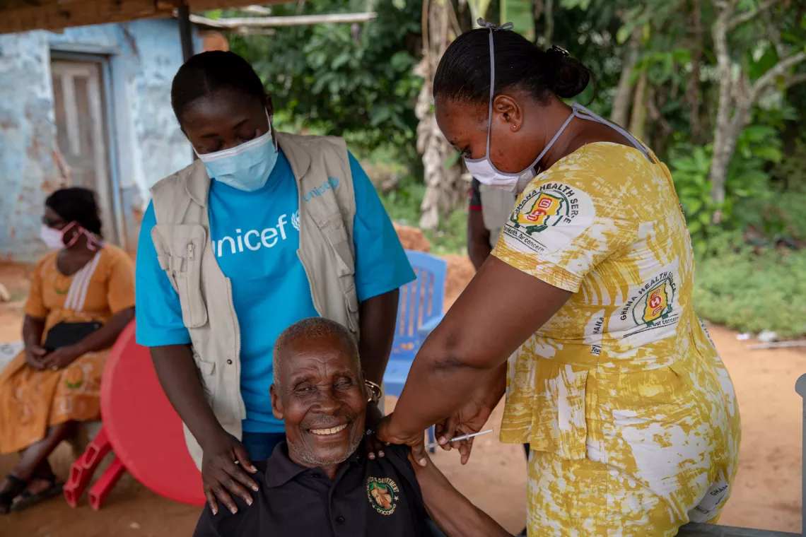 78-year-old retired farmer, Kwame Kwei, receives a shot of the COVID-19 vaccine in Bontrase, Ghana. 