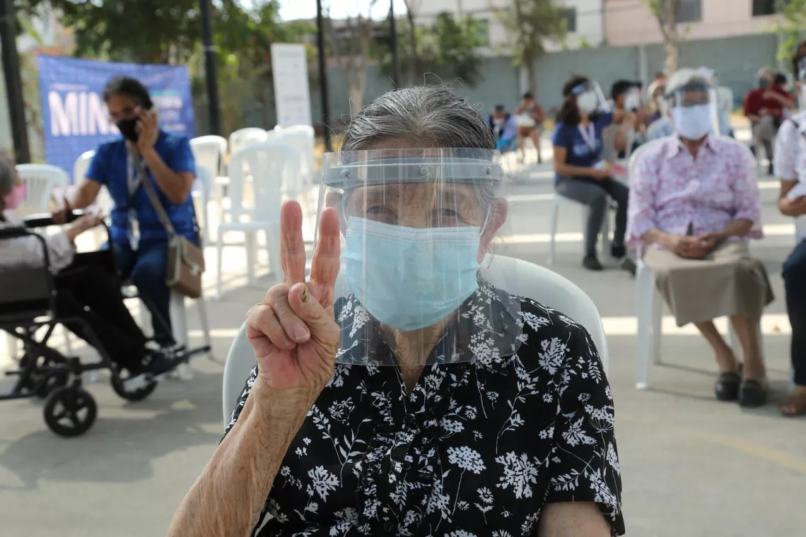 Older adults start to receive COVID-19 vaccines at a vaccination site in the district of San Martín de Porres in Lima, Peru. 
