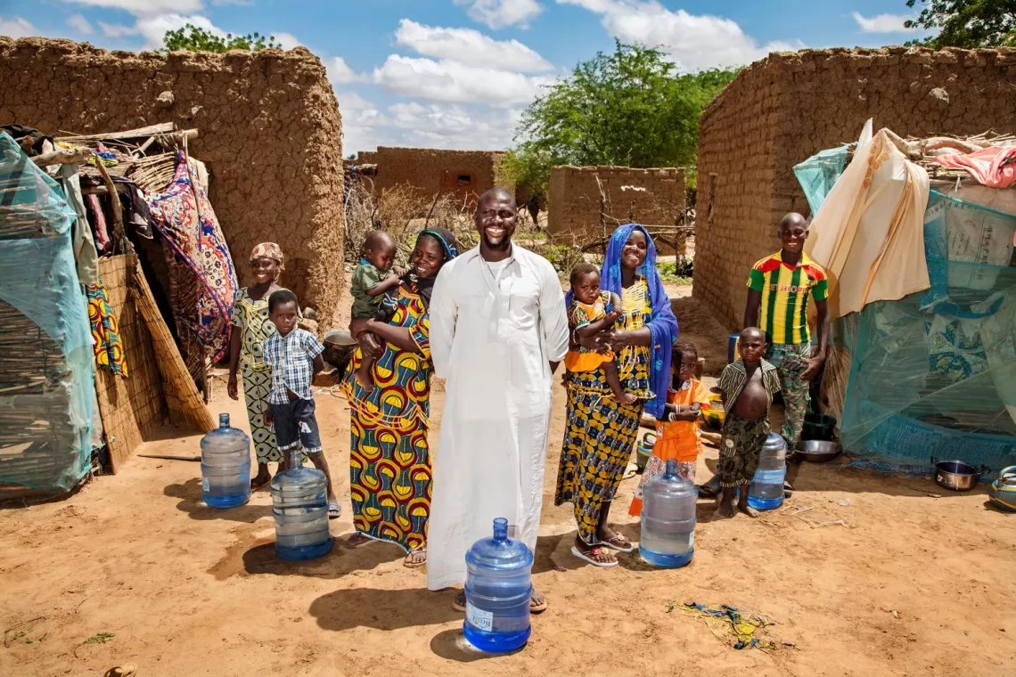 In late July 2015 in the Niger, (centre) Hamidou Hama stands with his family in the village of Diajourou, Tillabéri Region. 