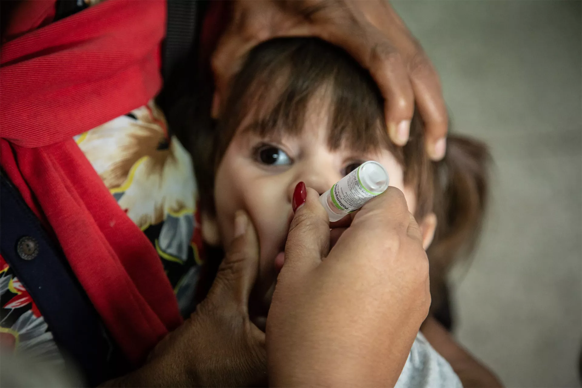 Young girl receives a vaccine in a health centre