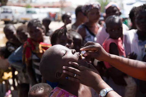  A child receives the vaccine for cholera at the Ifapa accommodation for people displaced by Cyclone Idai, in Beira, Mozambique, in April 2019.