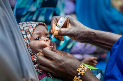A baby receiving the polio vaccine