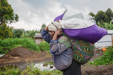 A woman carrying supplies received 